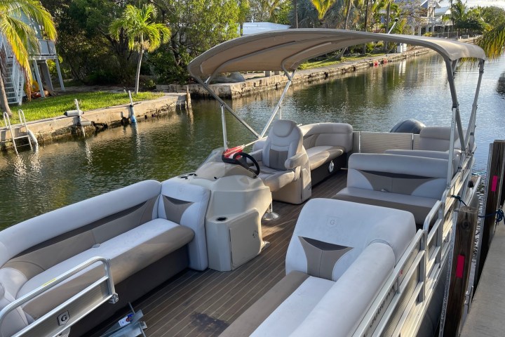 a boat parked on the side of a river